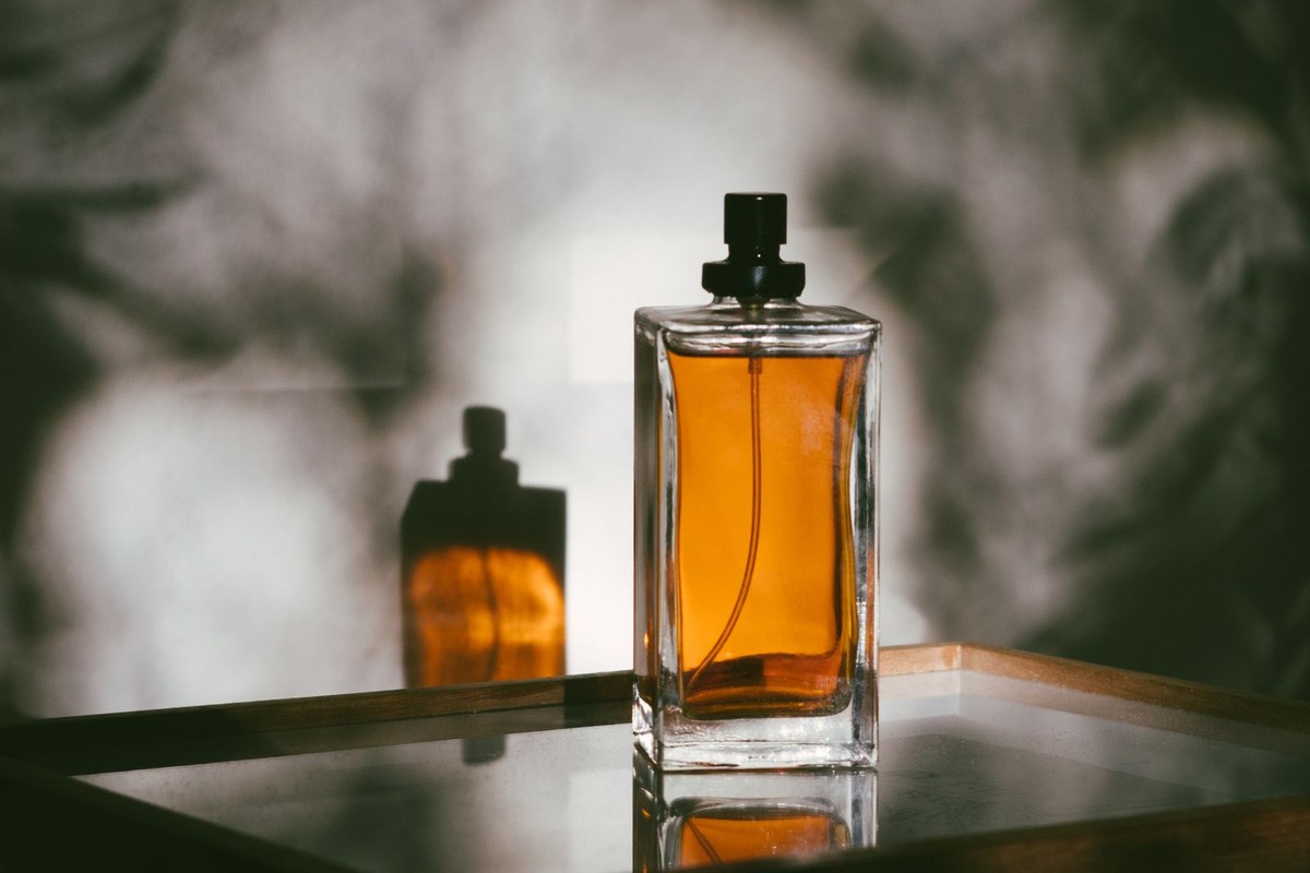 Beeswax taper burning against a dark, moody backdrop